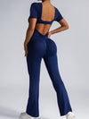 ZASUWA Female Deep V Back Backless Flare Scrunch Bum Jumpsuit