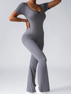 ZASUWA Female Deep V Back Backless Flare Scrunch Bum Jumpsuit